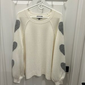 Elegant White Sweater with Gray Heart Details